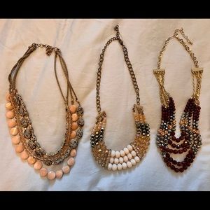 8 necklaces, mix of Anthropologie, DSW, Forever 21, and from boutiques abroad